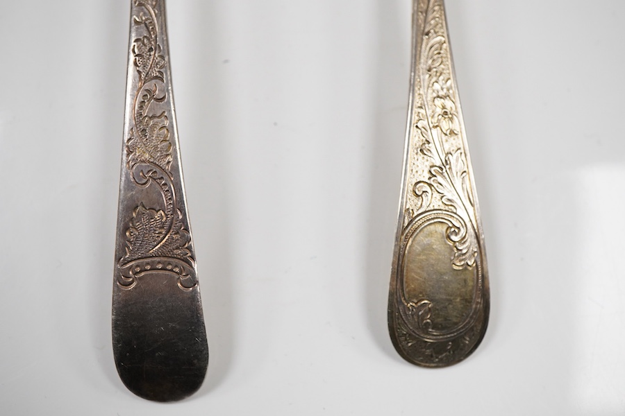 A pair of George III silver gilt Old English pattern berry spoons, London, 1787, 21.8cm, two other earlier silver berry spoons and an Edwardian serving spoon by William Hutton & Sons, London, 1901, 9oz.